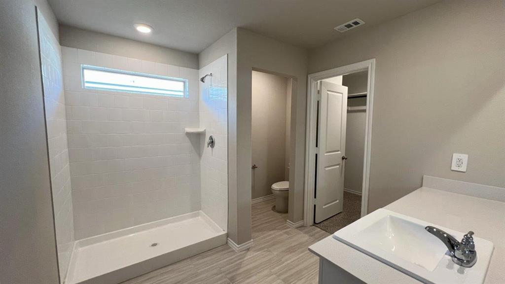 829 Round Robin Lane Rhome, TX 76078 - Photo 8 of 27 a bathroom with a sink and a mirror