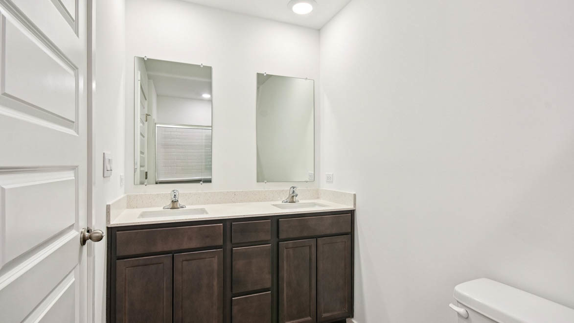 392 Summit Circle Lombard, IL 60148 - Photo 58 of 61 a bathroom with a double vanity sink toilet and mirror