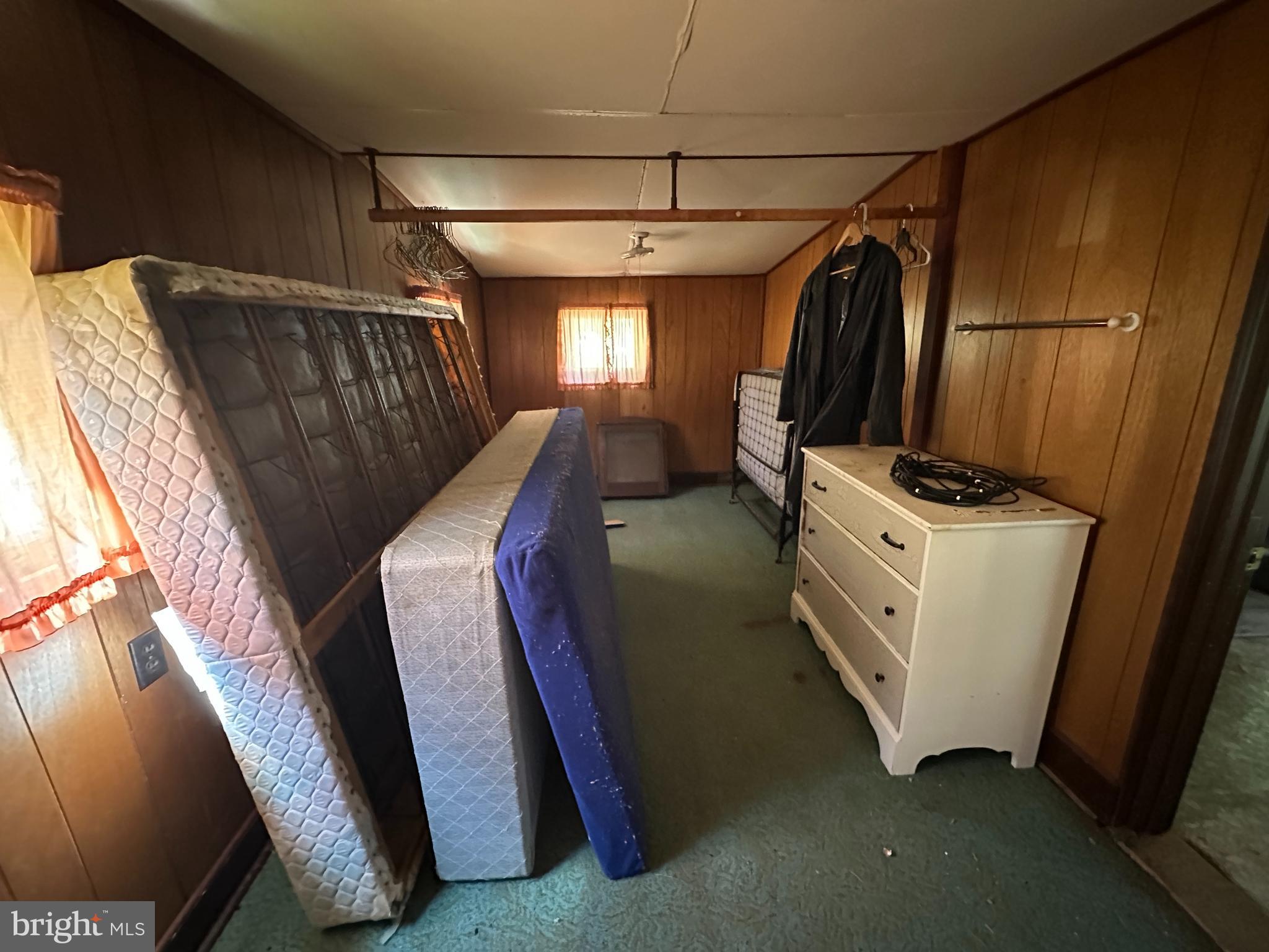 13726 Hopps Landing Road Hagerstown, MD 21740 - Photo 35 of 71 a view of walk in closet with clothes and shoes