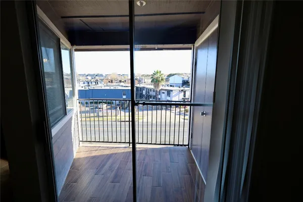 a view of a glass door with a balcony