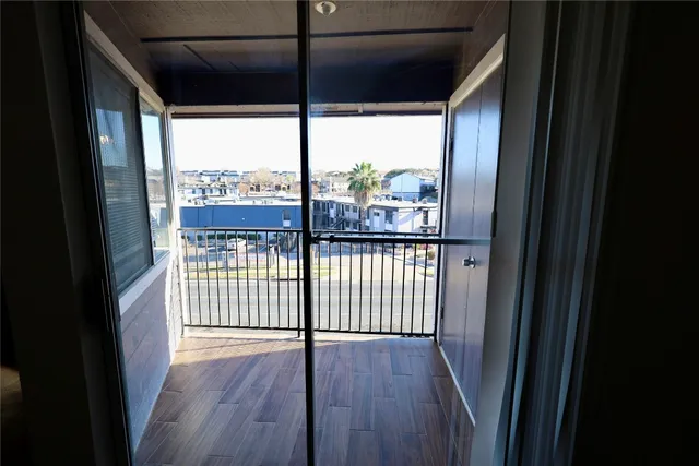 a view of a glass door with a balcony