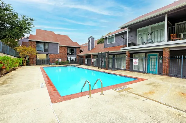 a view of swimming pool with a outdoor seating