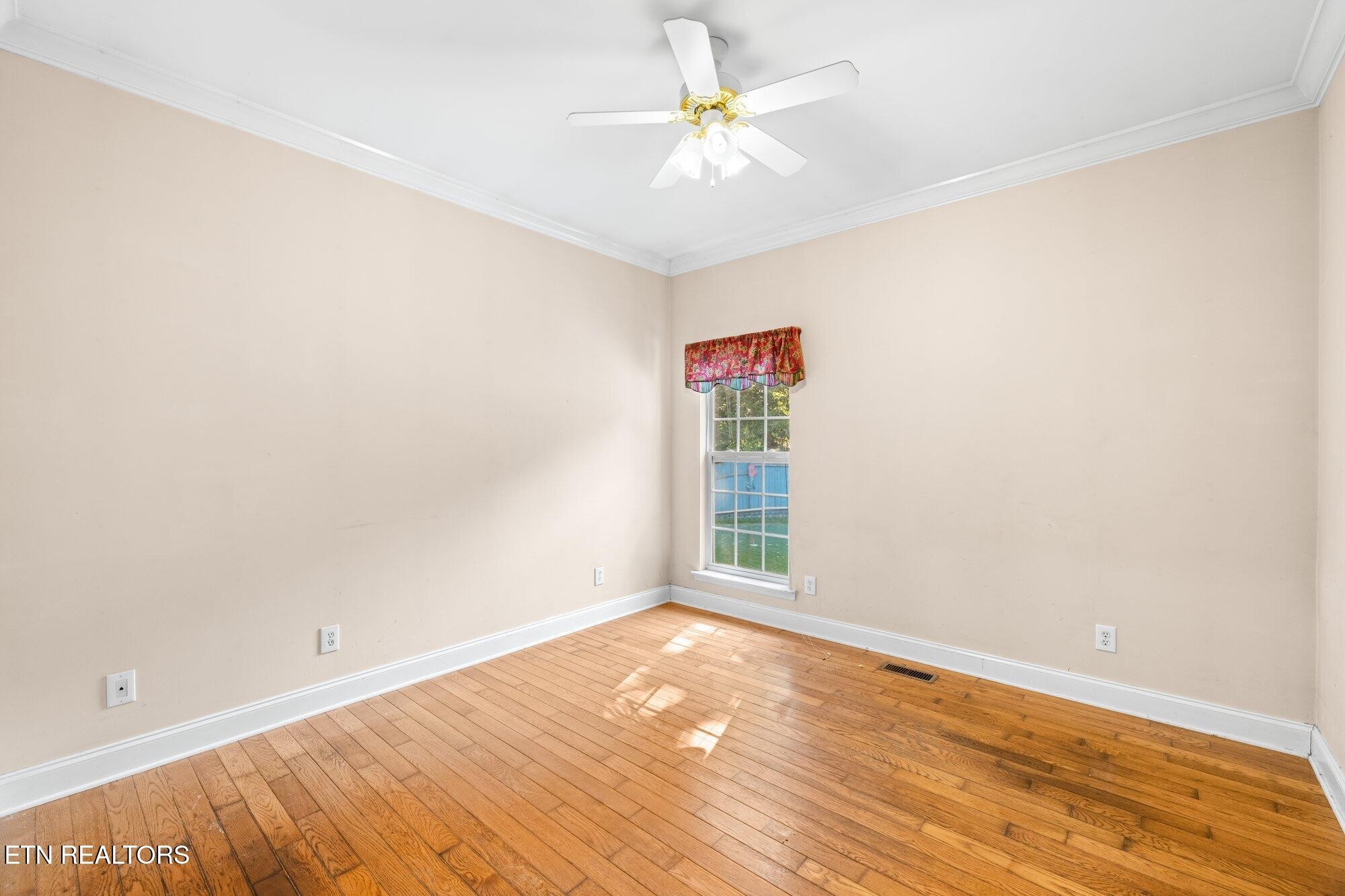 192 Savannah Ridge Trail Cleveland, TN 37323 - Photo 17 of 23 an empty room with a window and a ceiling fan