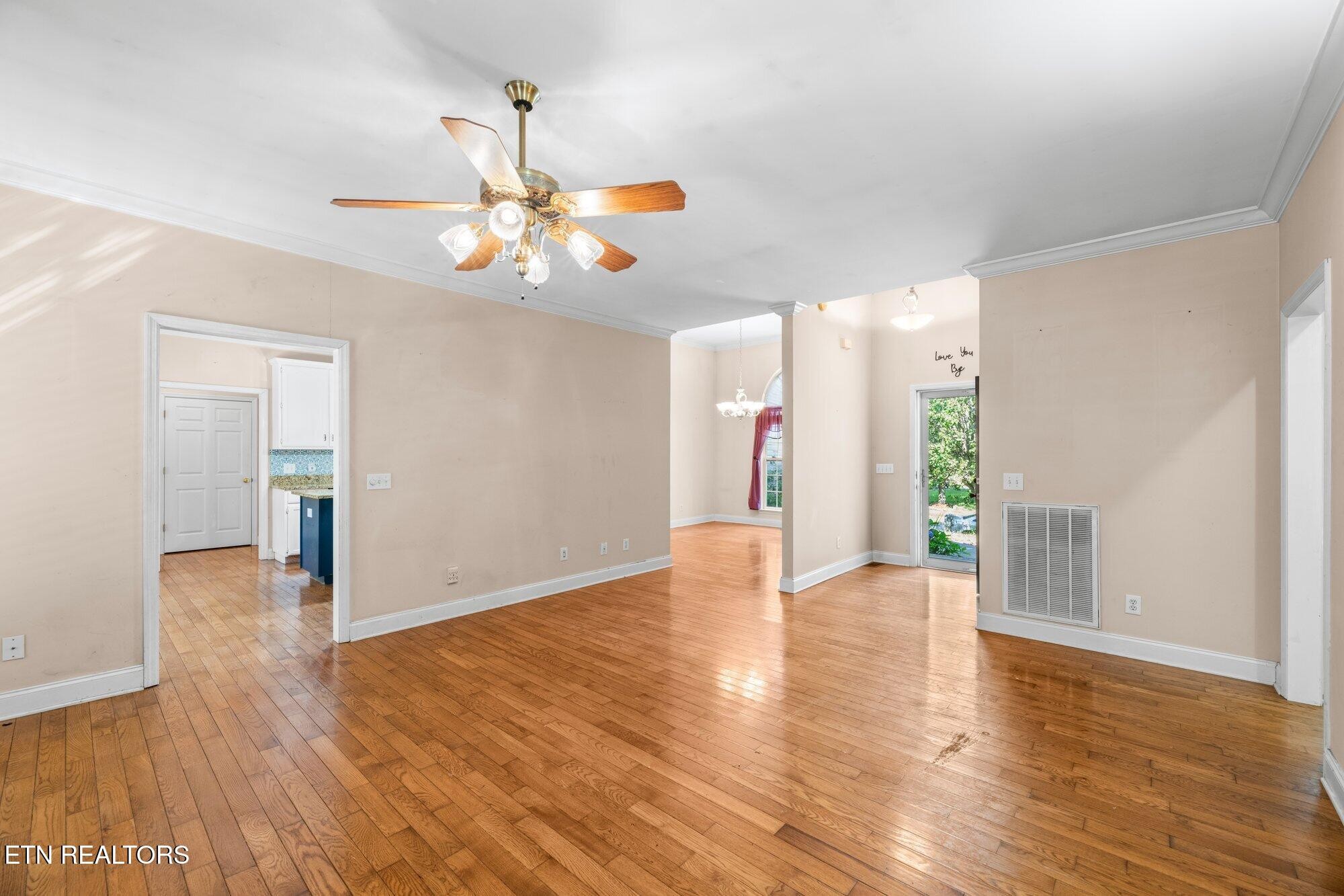 192 Savannah Ridge Trail Cleveland, TN 37323 - Photo 3 of 23 a view of an empty room with window and wooden floor