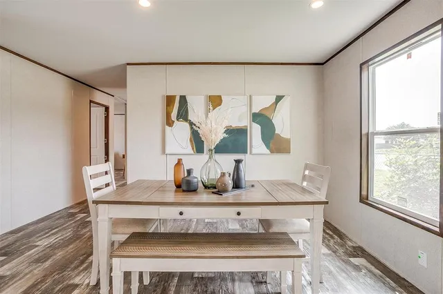 a dining room with table and window