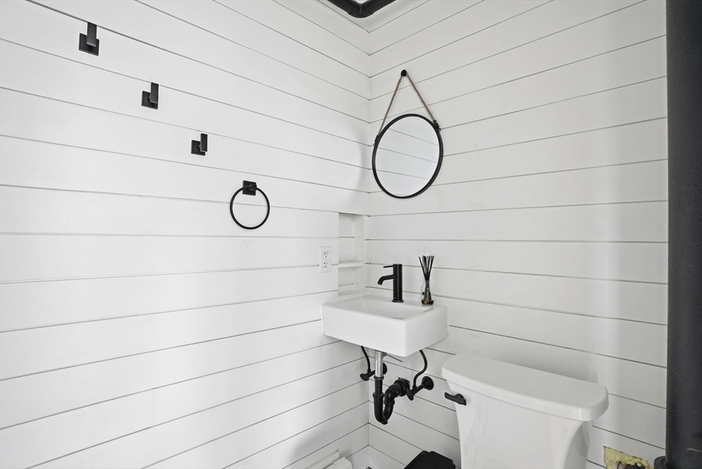 48 Bates Street Hull, MA 02045 - Photo 19 of 42 a bathroom with a sink a toilet and a shower