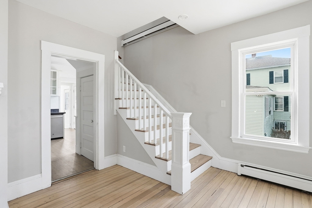 48 Bates Street Hull, MA 02045 - Photo 21 of 42 a view of entryway and hall with wooden floor