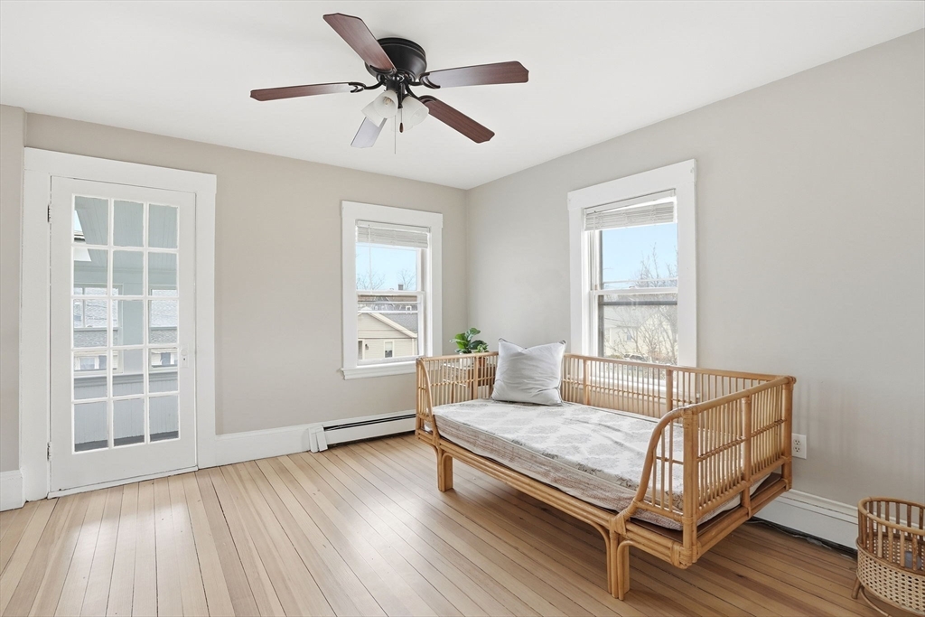 48 Bates Street Hull, MA 02045 - Photo 22 of 42 a living room with a bed furniture and a window