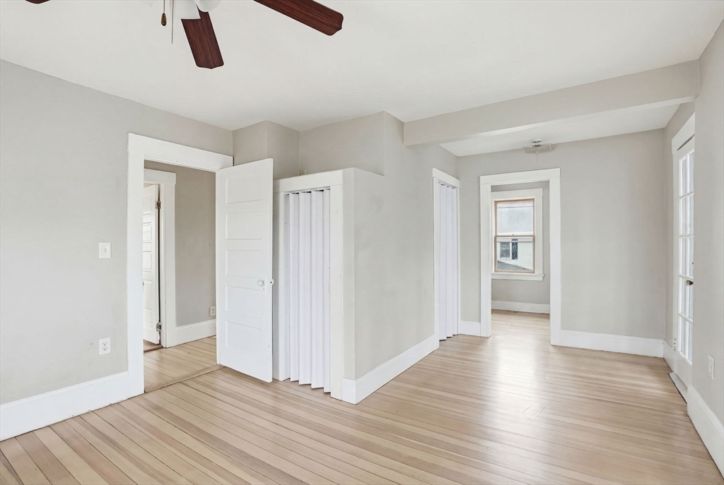 48 Bates Street Hull, MA 02045 - Photo 23 of 42 a view of an empty room with wooden floor