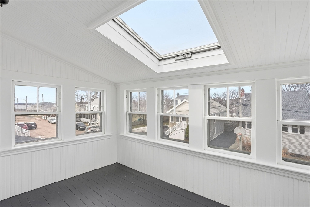 48 Bates Street Hull, MA 02045 - Photo 24 of 42 a view of an empty room with a window and wooden floor