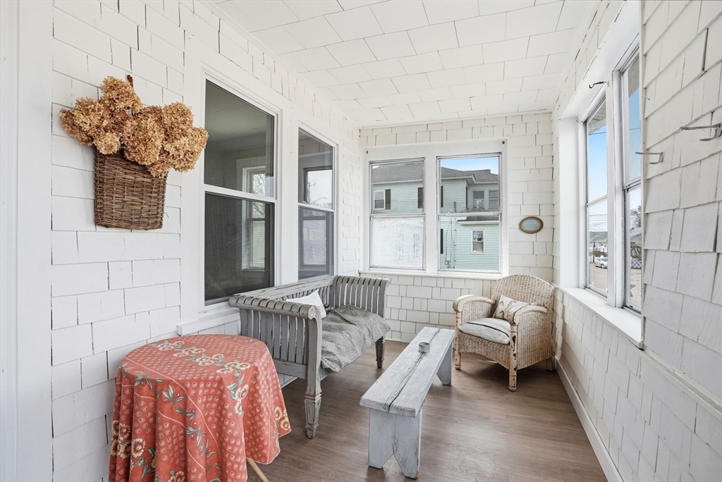 48 Bates Street Hull, MA 02045 - Photo 33 of 42 a living room with furniture and a potted plant