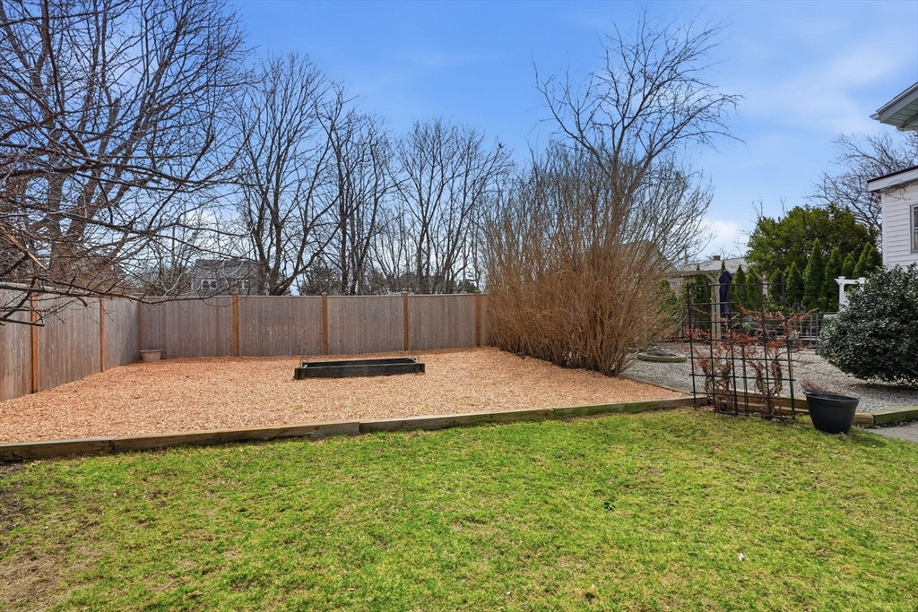 48 Bates Street Hull, MA 02045 - Photo 36 of 42 a backyard of a house with lots of green space