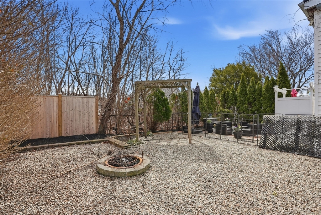 48 Bates Street Hull, MA 02045 - Photo 37 of 42 a backyard of a house with barbeque oven and tree