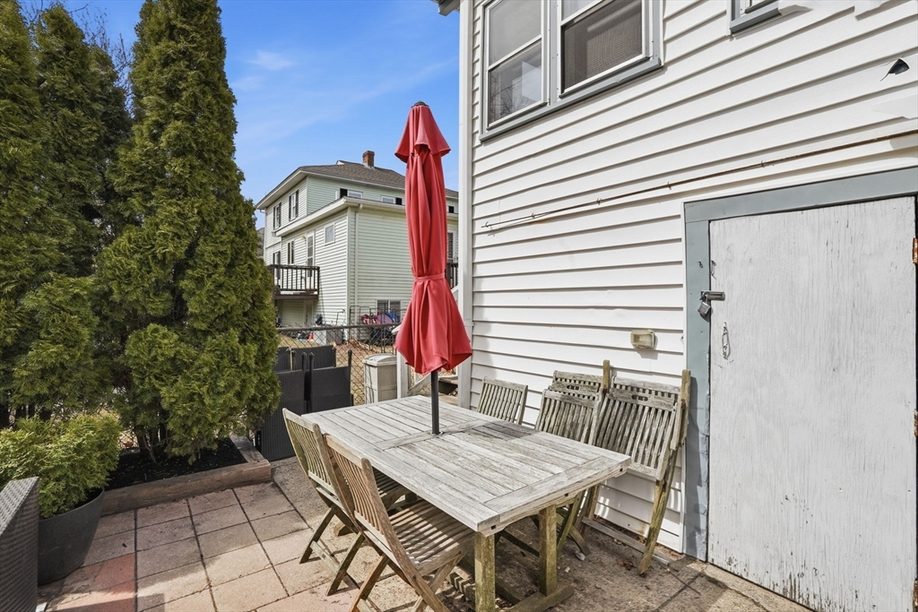 48 Bates Street Hull, MA 02045 - Photo 39 of 42 a view of a dinning table and chairs in patio