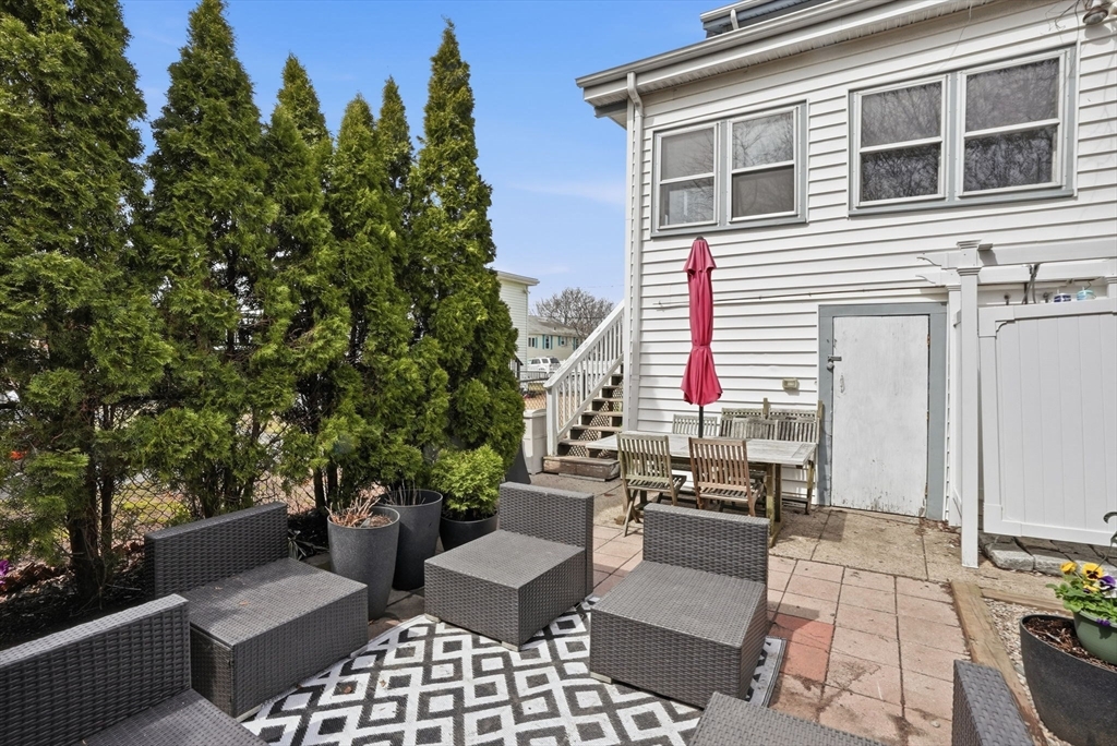 48 Bates Street Hull, MA 02045 - Photo 40 of 42 a view of a patio with couches and potted plants