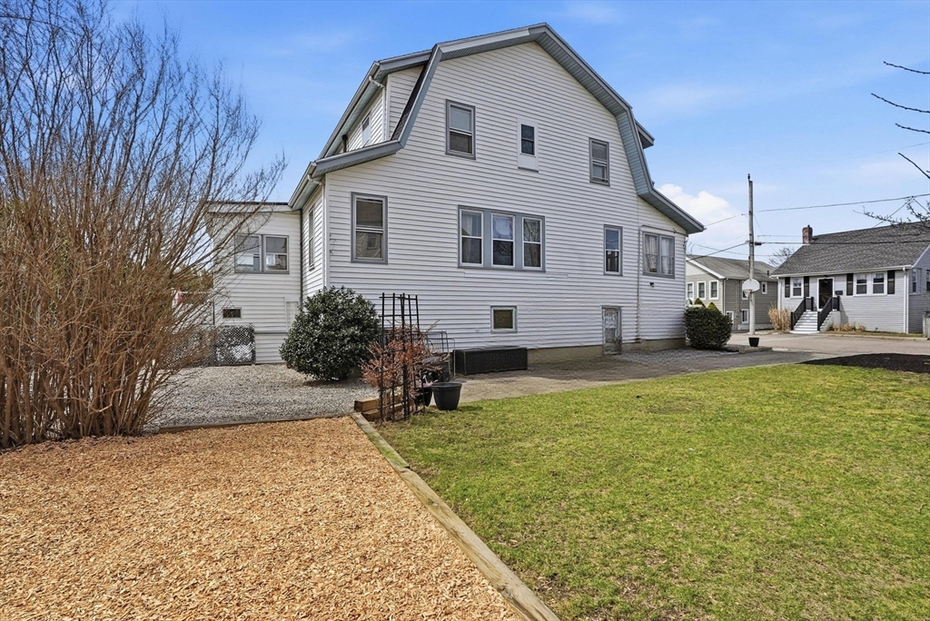 48 Bates Street Hull, MA 02045 - Photo 42 of 42 a view of a white house with a yard