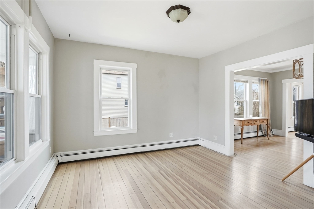 48 Bates Street Hull, MA 02045 - Photo 5 of 42 a view of a livingroom with wooden floor and a window