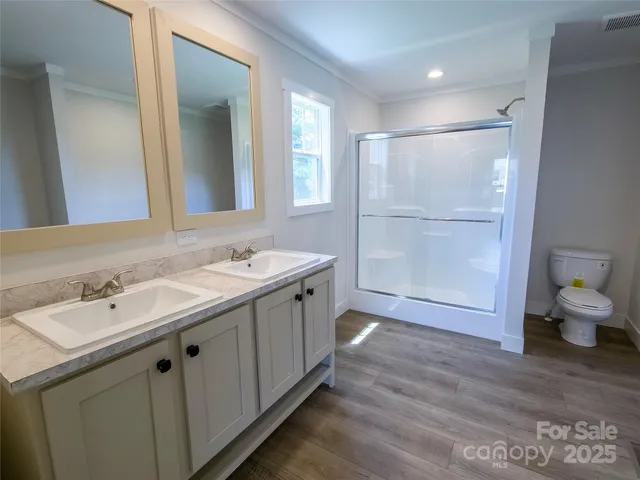 a bathroom with a sink and vanity