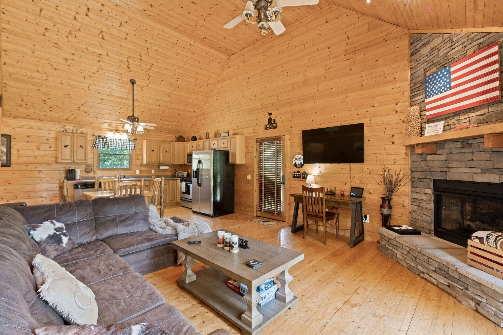 947 Belltown Road Copperhill, TN 37317 - Photo 2 of 26 a living room with furniture a flat screen tv and a fireplace