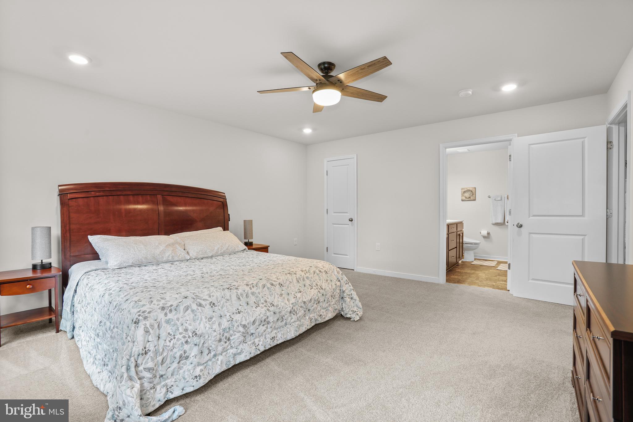 662 North Glebe Road Montross, VA 22520 - Photo 12 of 34 a bedroom with a bed and a chandelier