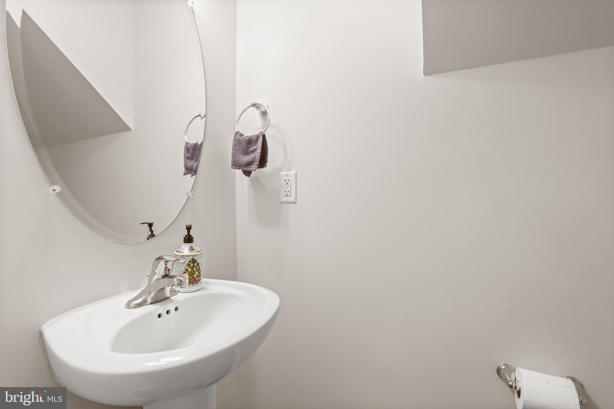 662 North Glebe Road Montross, VA 22520 - Photo 14 of 34 a bathroom with a sink and mirror