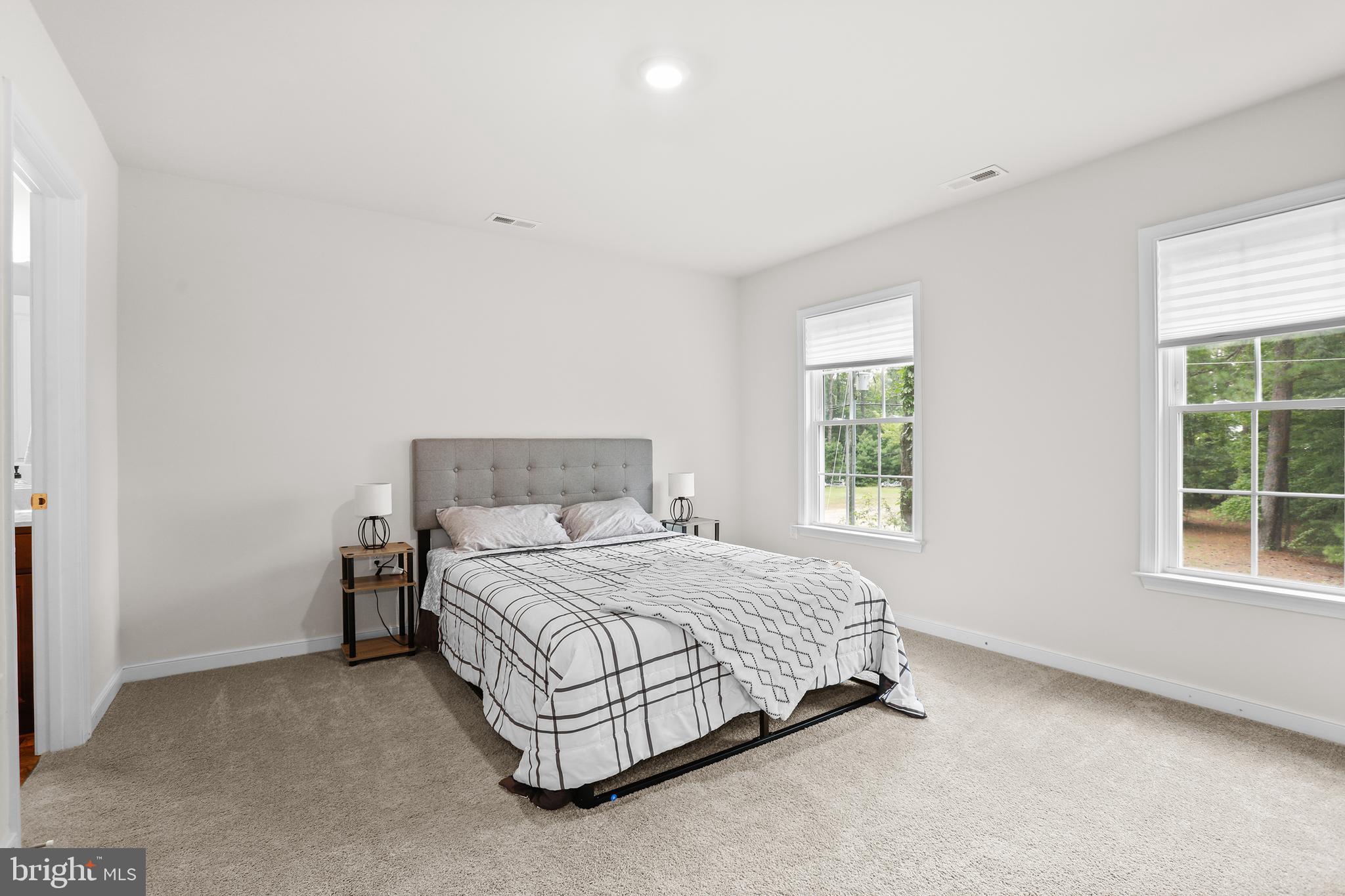 662 North Glebe Road Montross, VA 22520 - Photo 15 of 34 a bedroom with a bed and a window