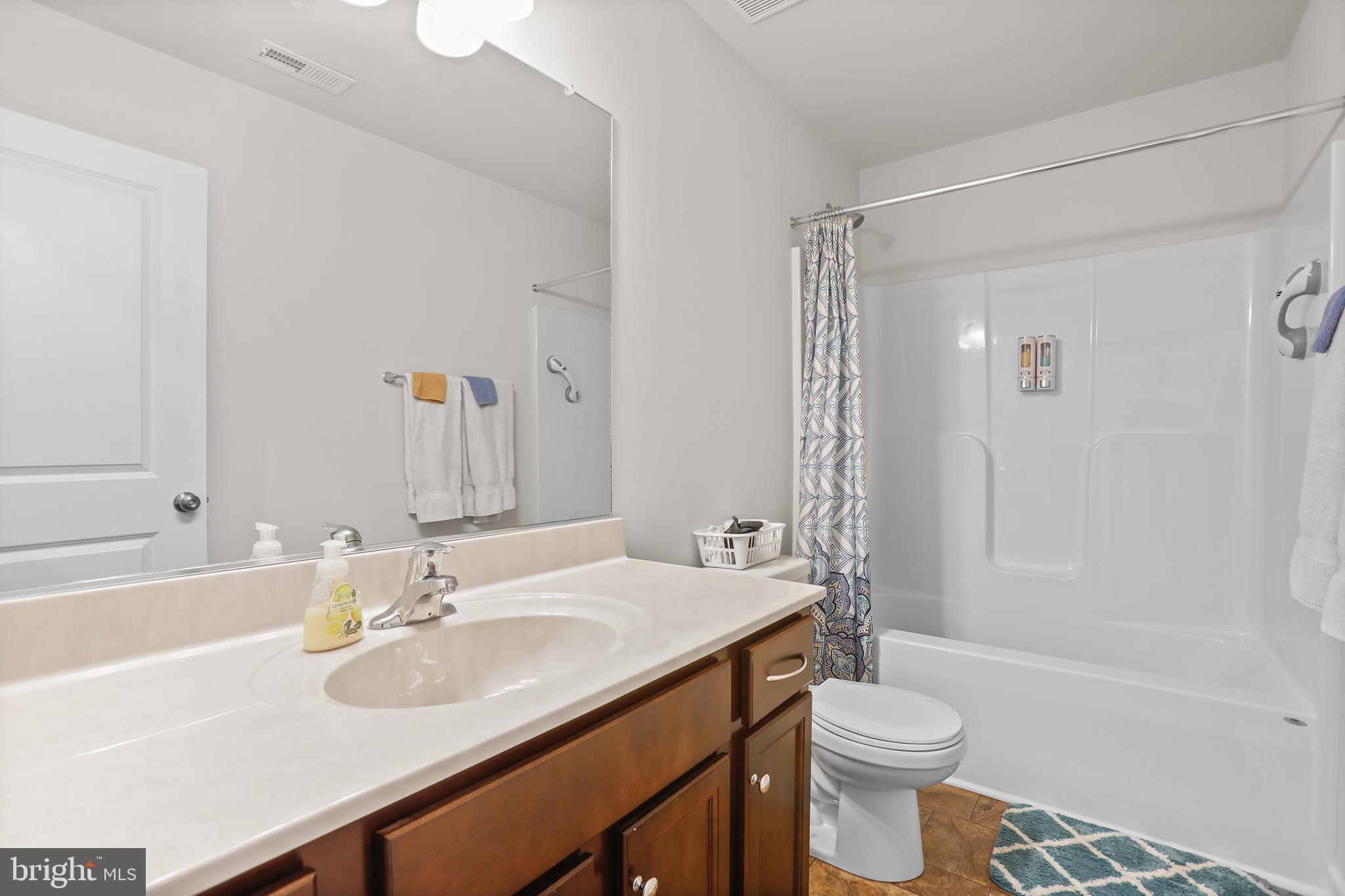 662 North Glebe Road Montross, VA 22520 - Photo 18 of 34 a bathroom with a sink toilet vanity and shower