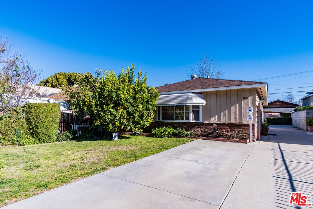 3865 Edenhurst Avenue Los Angeles, CA 90039 - Photo 1 of 22 a front view of a house with a yard