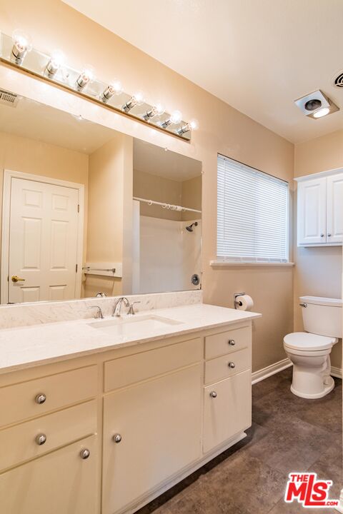 3865 Edenhurst Avenue Los Angeles, CA 90039 - Photo 12 of 22 a bathroom with a double vanity sink and a toilet
