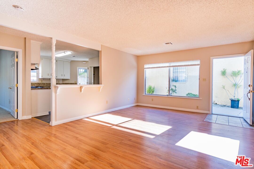 3865 Edenhurst Avenue Los Angeles, CA 90039 - Photo 14 of 22 a view of an empty room with wooden floor and a window