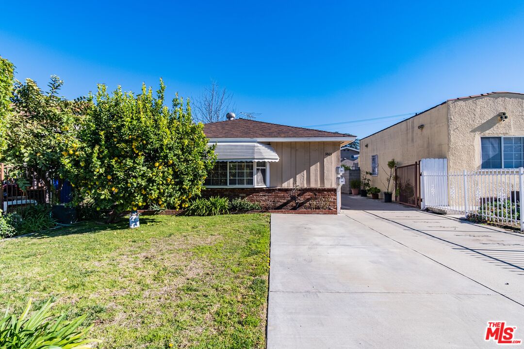 3865 Edenhurst Avenue Los Angeles, CA 90039 - Photo 22 of 22 a view of a house with backyard and a tree