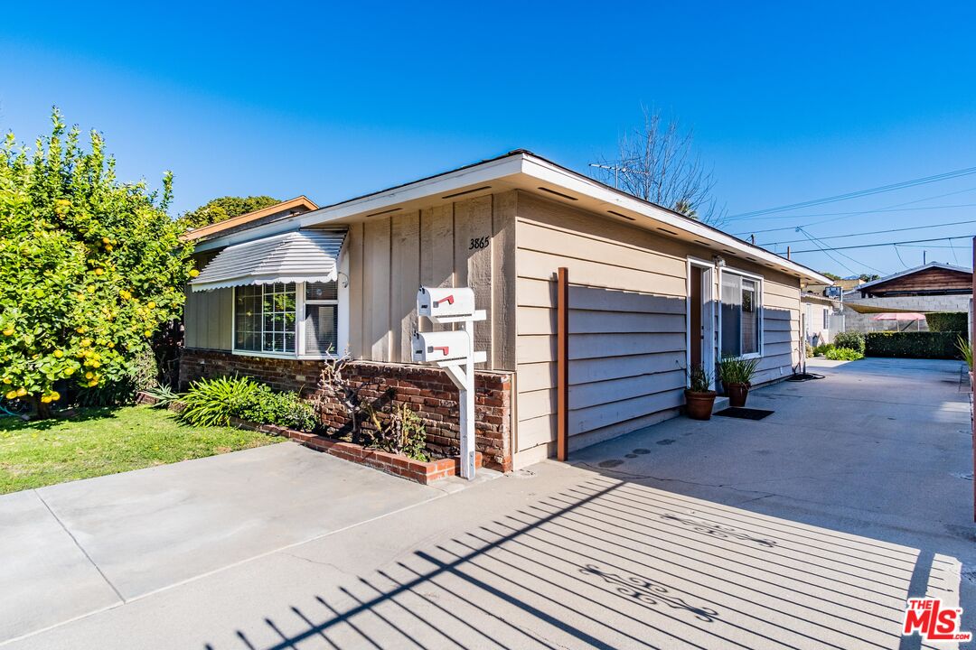 3865 Edenhurst Avenue Los Angeles, CA 90039 - Photo 3 of 22 a front view of a house with a yard