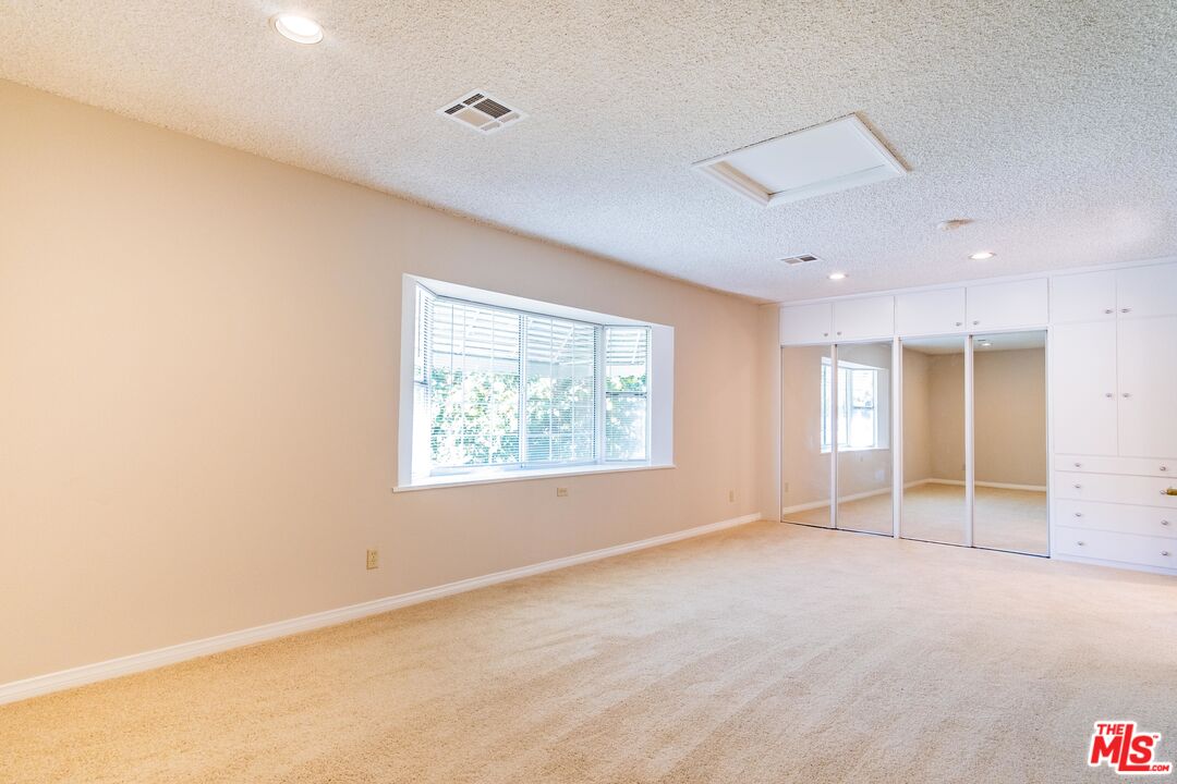 3865 Edenhurst Avenue Los Angeles, CA 90039 - Photo 10 of 22 an empty room with windows