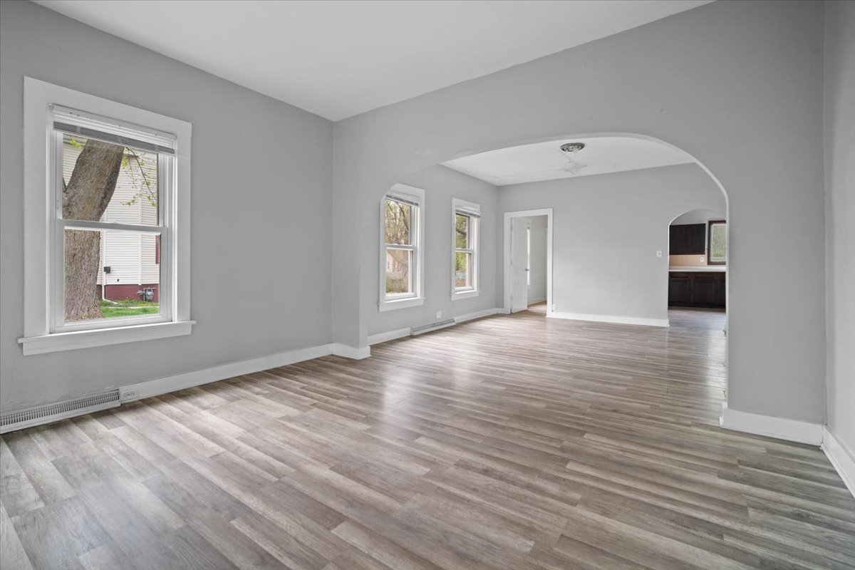 803 West Grove Street Bloomington, IL 61701 - Photo 12 of 13 a view of an empty room with wooden floor and a window