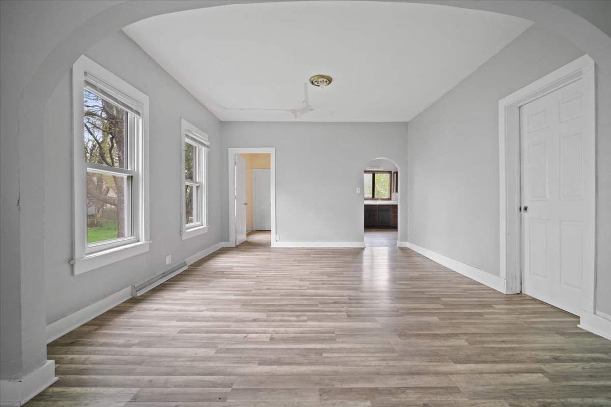 803 West Grove Street Bloomington, IL 61701 - Photo 5 of 13 a view of empty room with wooden floor and window