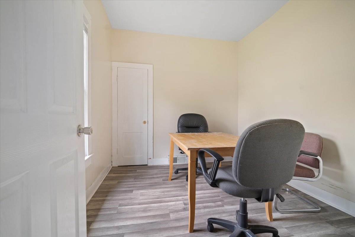 803 West Grove Street Bloomington, IL 61701 - Photo 6 of 13 a workspace with furniture and wooden floor