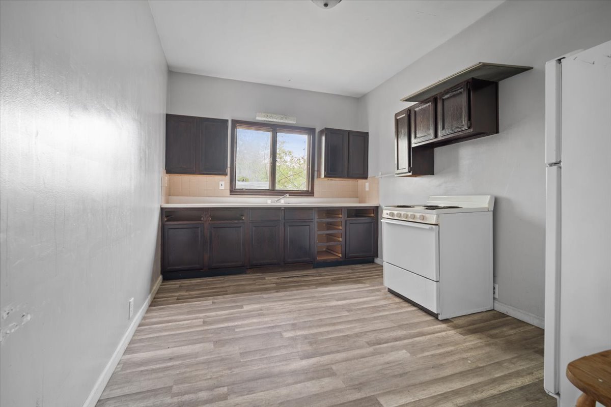 803 West Grove Street Bloomington, IL 61701 - Photo 7 of 13 a view of kitchen with wooden floor