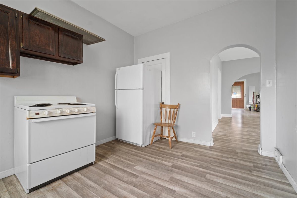 803 West Grove Street Bloomington, IL 61701 - Photo 8 of 13 a view of a kitchen with stove and wooden floor