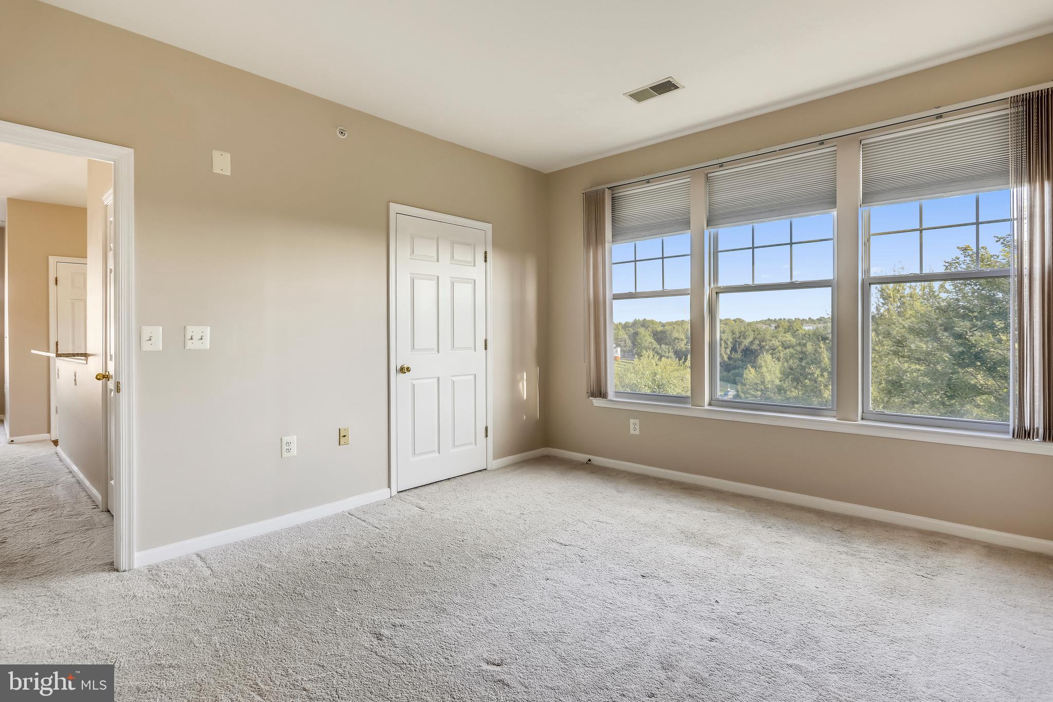 120 Chevy Chase Street, Unit 405 Gaithersburg, MD 20878 - Photo 18 of 34 Spacious Owner's Bedroom with Large Walk-In Closet