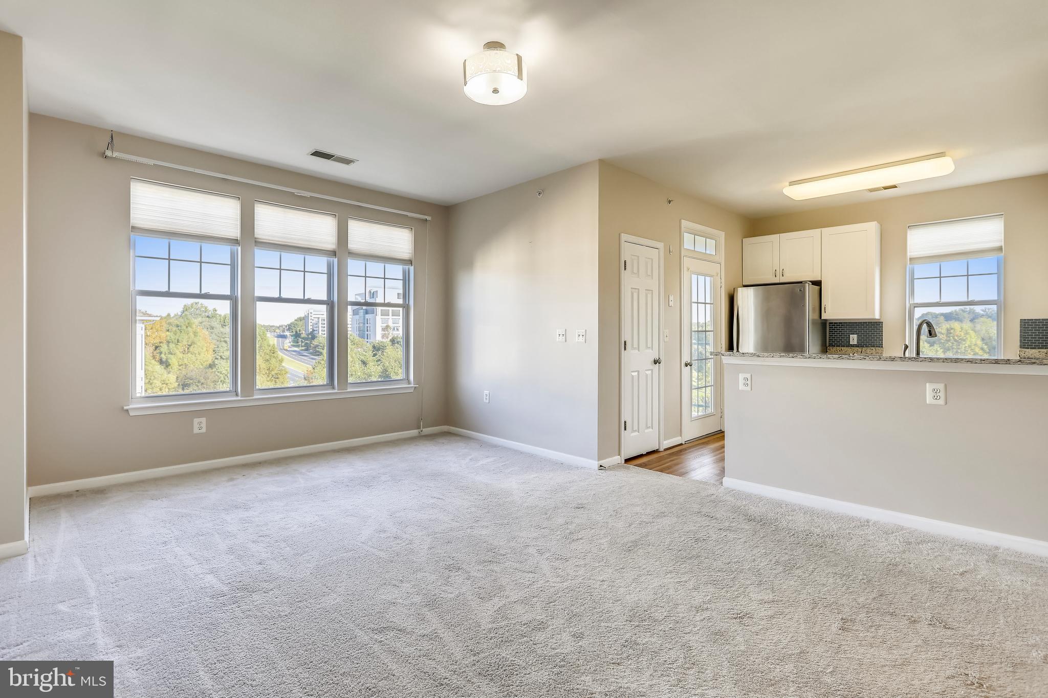 120 Chevy Chase Street, Unit 405 Gaithersburg, MD 20878 - Photo 19 of 34 Spacious Living Room Open to Kitchen & Dining Room