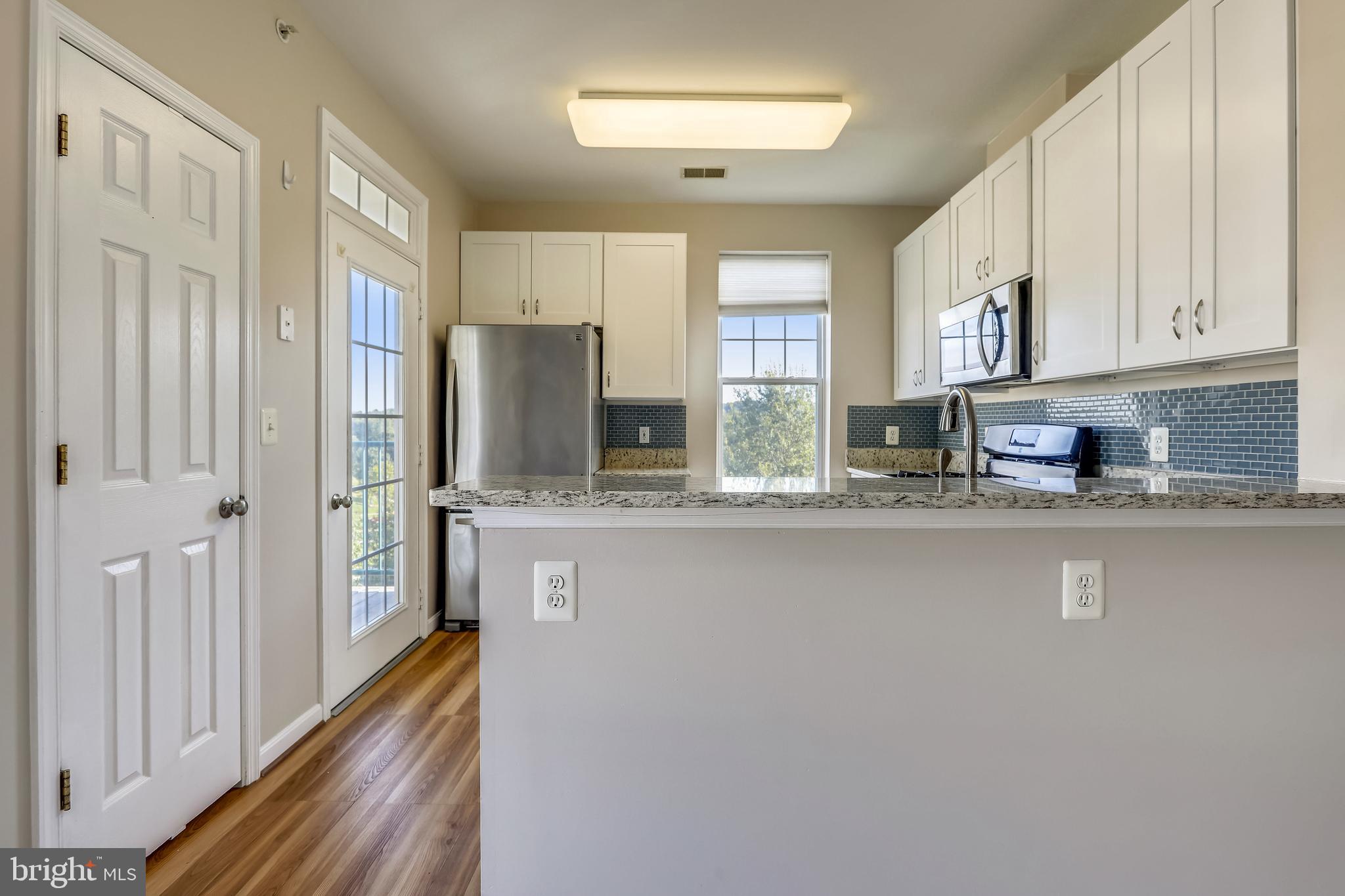 120 Chevy Chase Street, Unit 405 Gaithersburg, MD 20878 - Photo 7 of 34 Kitchen has all New Cabinets & Open to Living Room