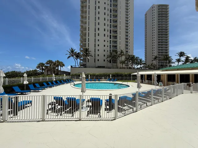 a view of a chairs and table in patio