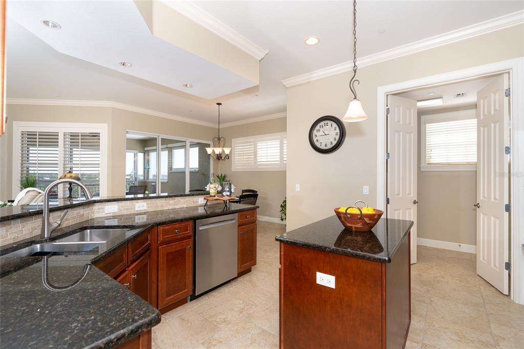 10501 Amberjack Way, Unit 402 Englewood, FL 34224 - Photo 13 of 45 a large white kitchen with a large tub