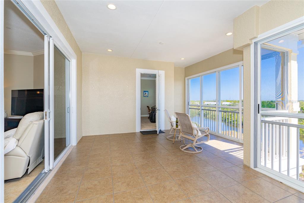 10501 Amberjack Way, Unit 402 Englewood, FL 34224 - Photo 21 of 45 a view of an empty room and glass door