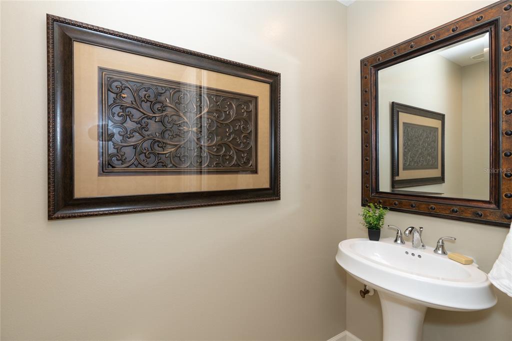 10501 Amberjack Way, Unit 402 Englewood, FL 34224 - Photo 32 of 45 a bathroom with a sink and a mirror