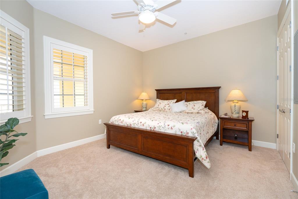 10501 Amberjack Way, Unit 402 Englewood, FL 34224 - Photo 35 of 45 a bedroom with a bed and window