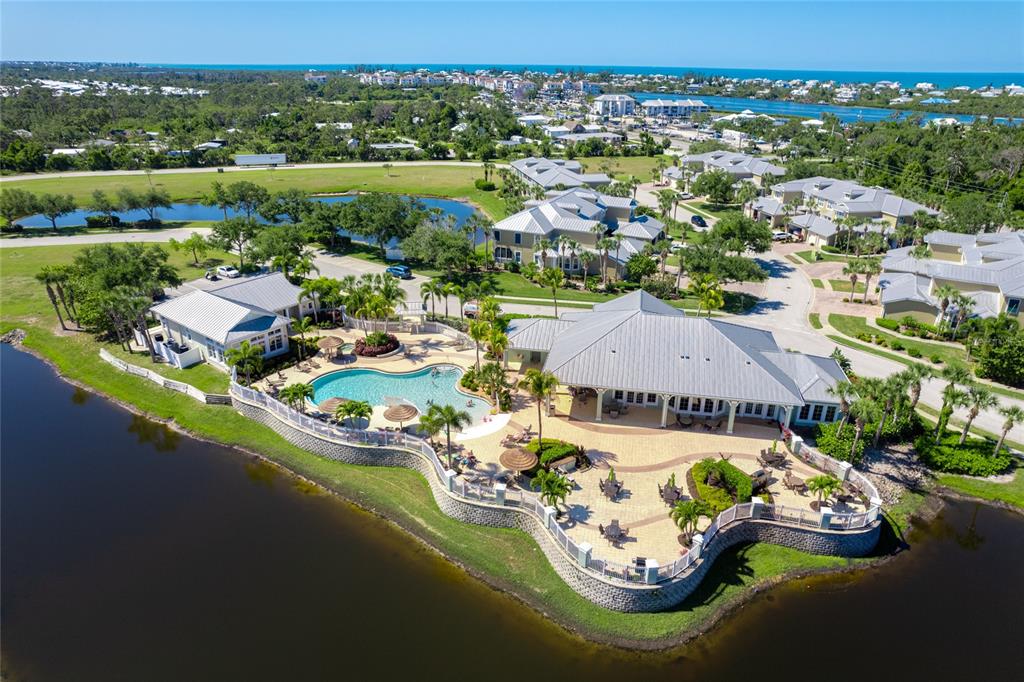 10501 Amberjack Way, Unit 402 Englewood, FL 34224 - Photo 42 of 45 an aerial view of a house with a garden and lake view