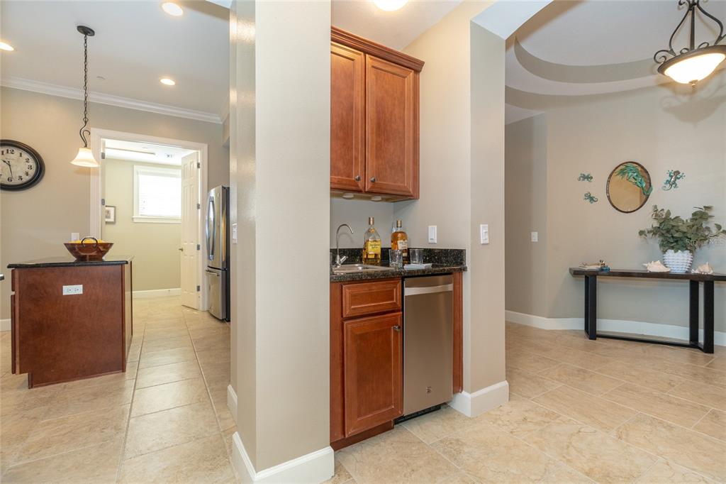 10501 Amberjack Way, Unit 402 Englewood, FL 34224 - Photo 8 of 45 a view of a kitchen cabinets and a stove