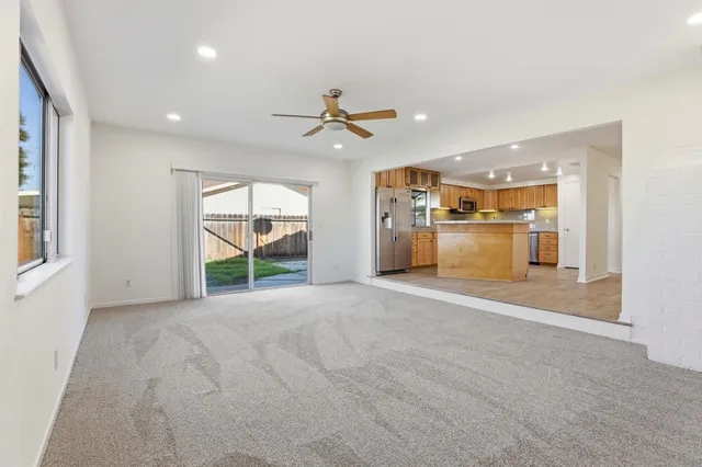 a view of a kitchen with a stove and a large window