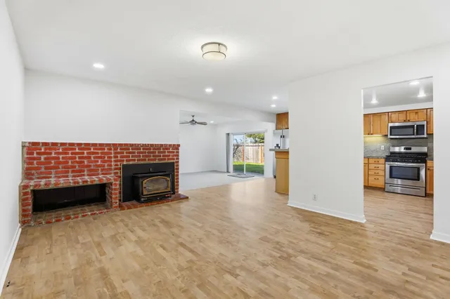 a view of kitchen with furniture and a fireplace